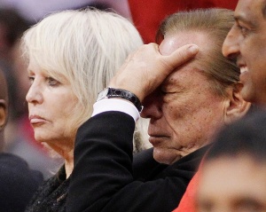 Los Angeles Clippers owner Sterling puts his hand over his face in the second half of an NBA basketball game in Los Angeles